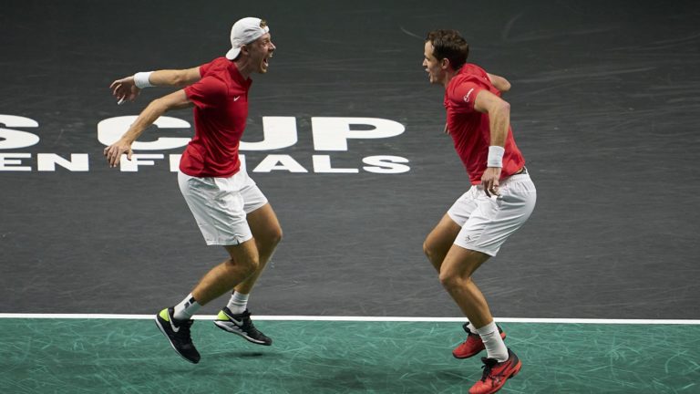 Denis Shapovalov and Vasek Pospisil prepare to leap into each other's arms.