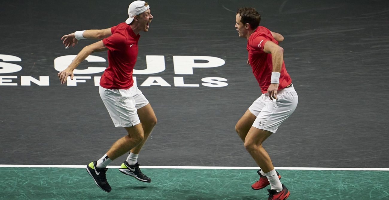 Denis Shapovalov and Vasek Pospisil prepare to leap into each other's arms.