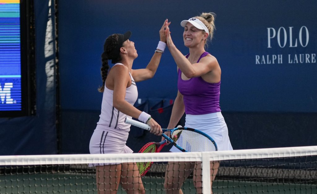 Gabriela Dabrowski (right) high-fives Giuliana Olmos.