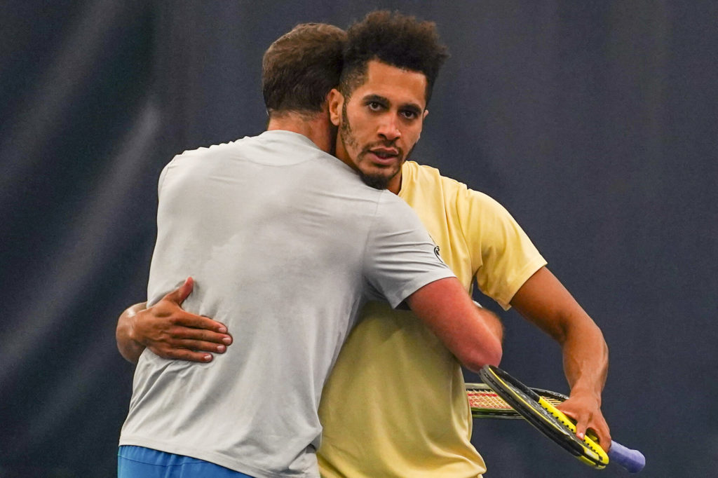 Pospisil and Mmoh embrace