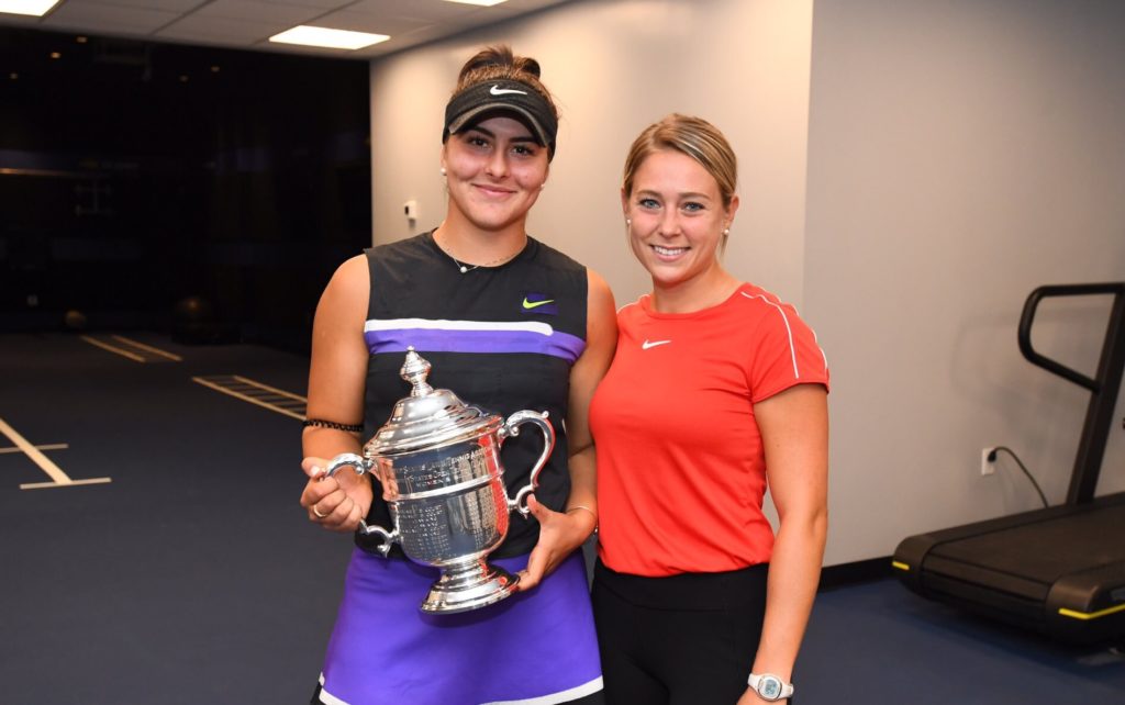 Bianca Andreescu (left) holds the US Open trophy next to Virginie Tremblay