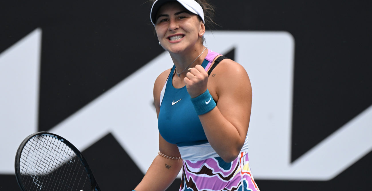 Bianca Andreescu pumps her fist and grits her teeth.