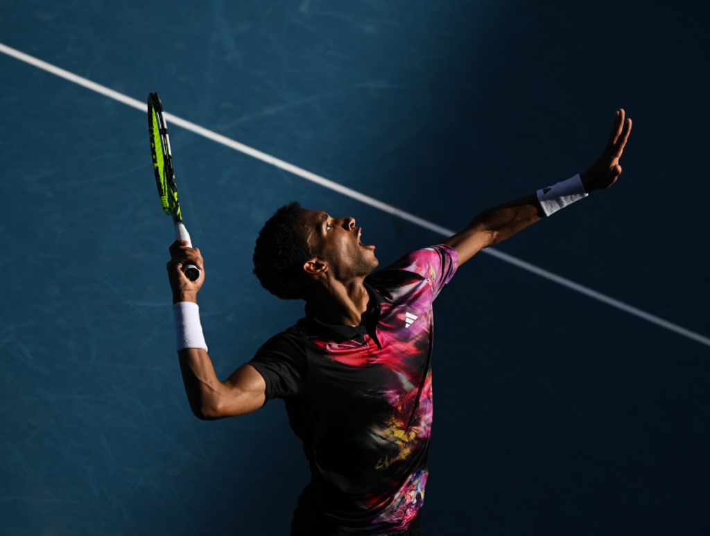 Felix Auger-Aliassime prepares to serve.