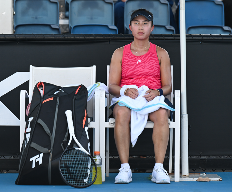 Carol Zhao sits during a changeover.