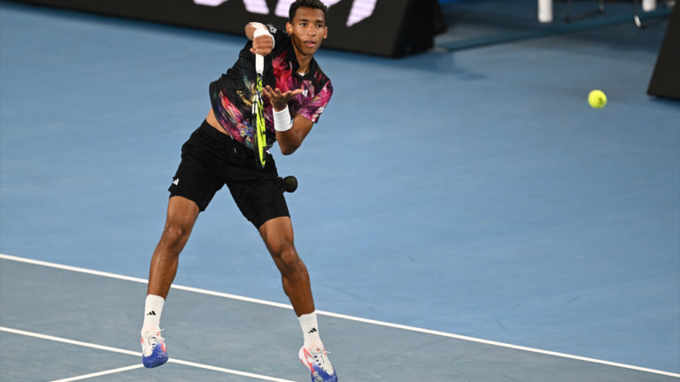 auger-aliassime leaps volley at Australian Open