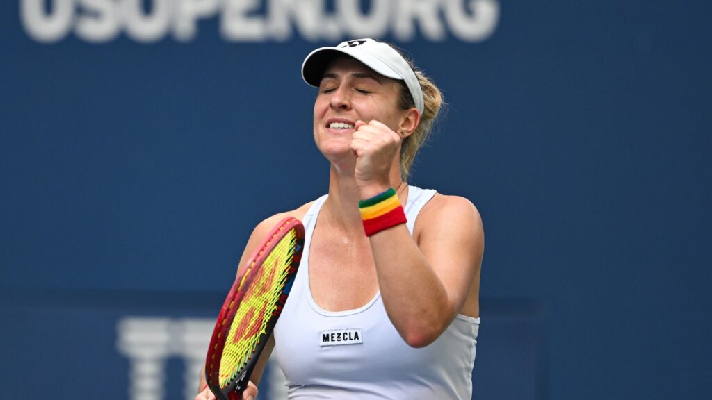 Gabriela Dabrowski closes her eyes and pumps her fist.
