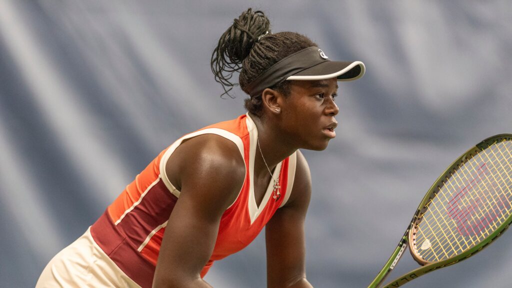 Victoria Mboko readies herself to play tennis