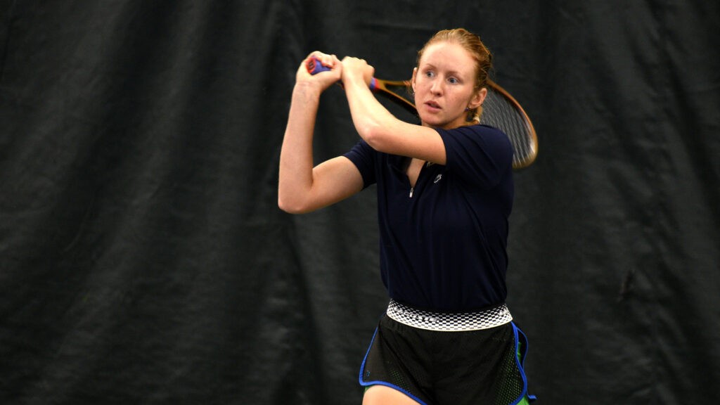 Sebov swings her tennis racket