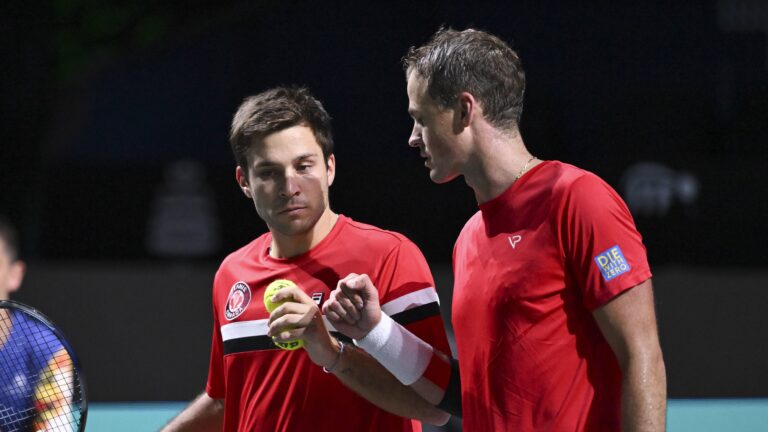 Alexis Galarneau (left) and Vasek Pospisil (right) fist pump during Canada's Davis Cup loss to Finland.