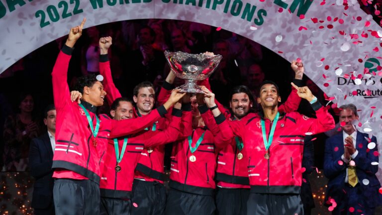 Team Canada lifts the Davis Cup trophy after winning it in 2022.