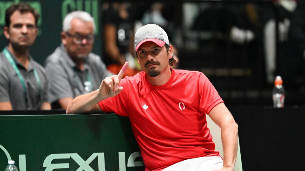 Frank Dancevic raises a finger on the team bench. He will captain Canada at the Montreal Davis Cup Qualifier.