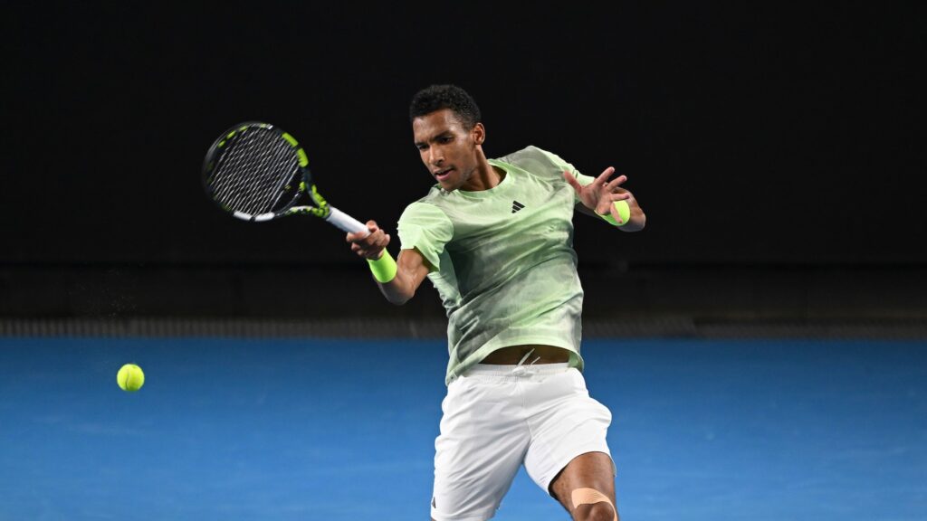 Felix Auger-Aliassime hits a forehand during his loss to Daniil Medvedev at the Australian Open.