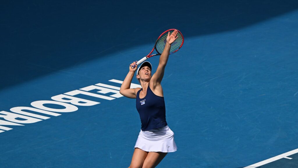 Gabriela Dabrowski tosses a ball up to serve at the Australian Open. She and Rob Shaw were both eliminated on Friday.