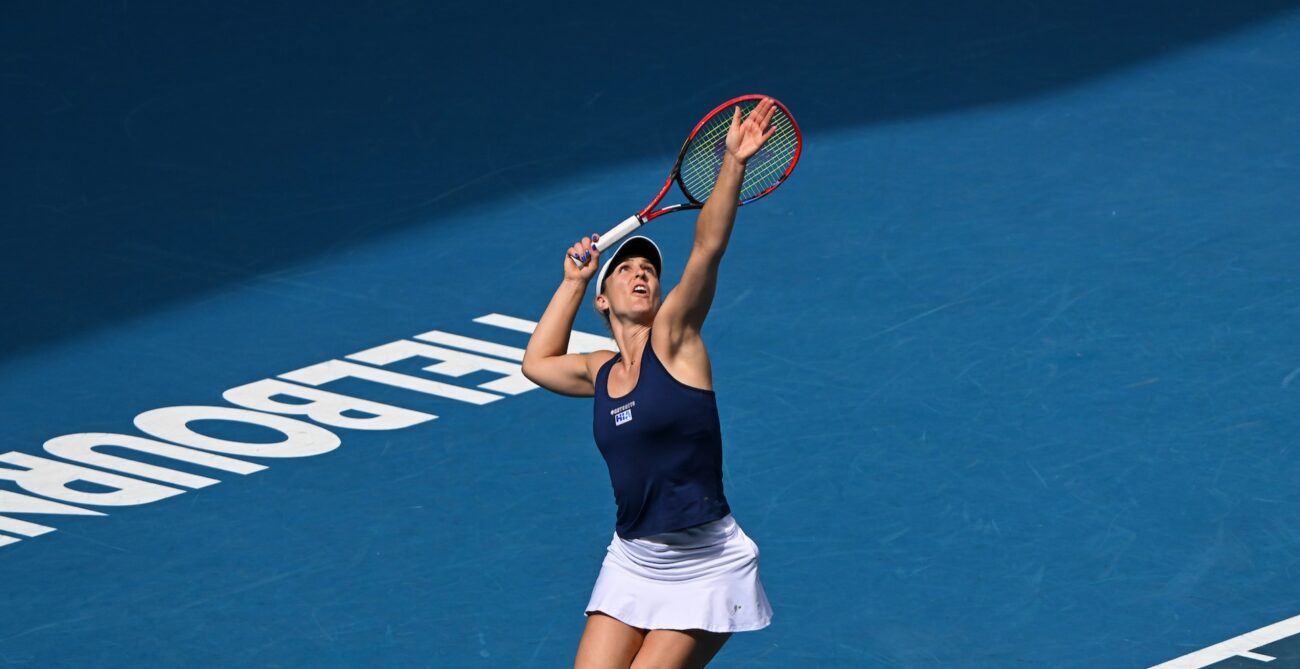 Gabriela Dabrowski tosses a ball up to serve at the Australian Open. She and Rob Shaw were both eliminated on Friday.