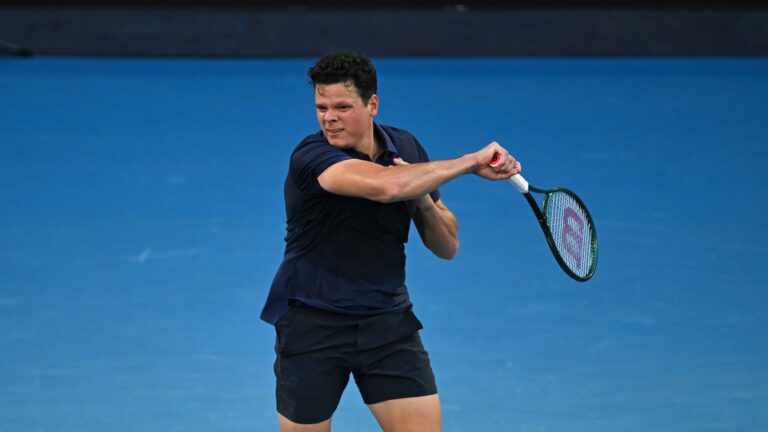 Milos Raonic follows through on a forehand. He lost to Jannik Sinner in Rotterdam.