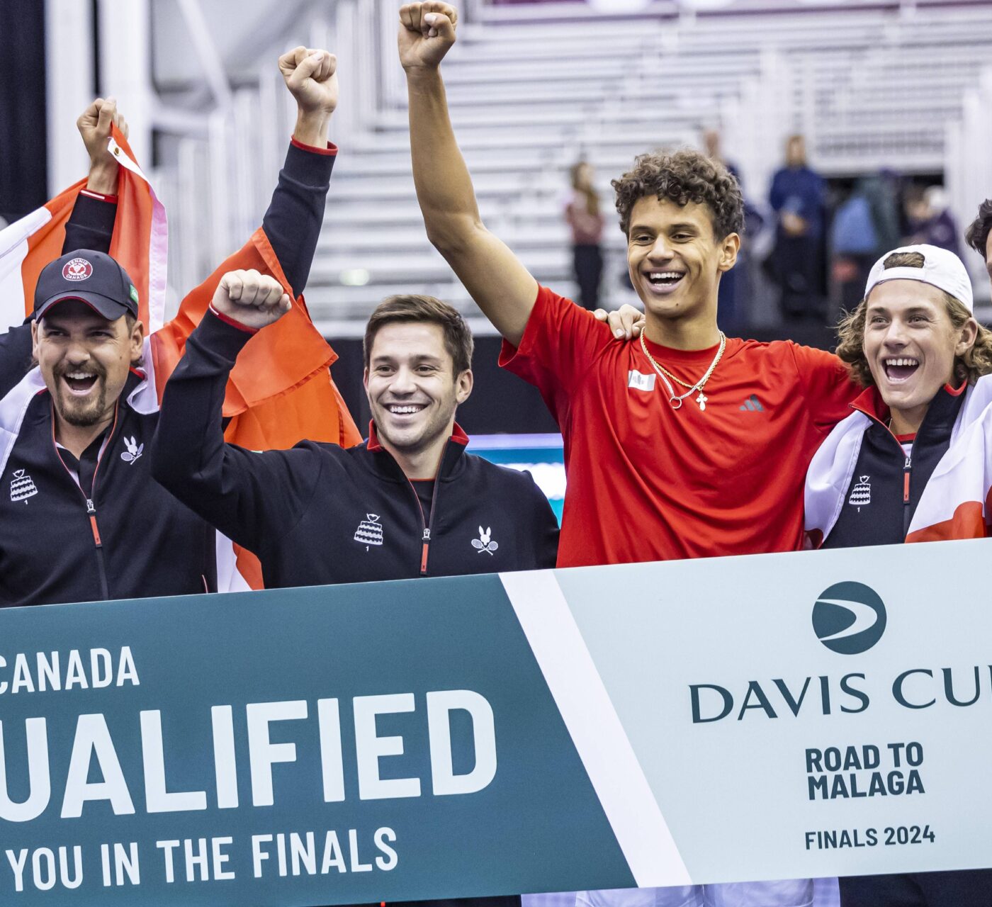 From left to right, Casek Pospisil, Frank Dancevic, Alexis Galarneau, Gabriel Diallo, Liam Draxl, and Milos Raonic celebrate the Davis Cup win for Team Canada in Montreal.