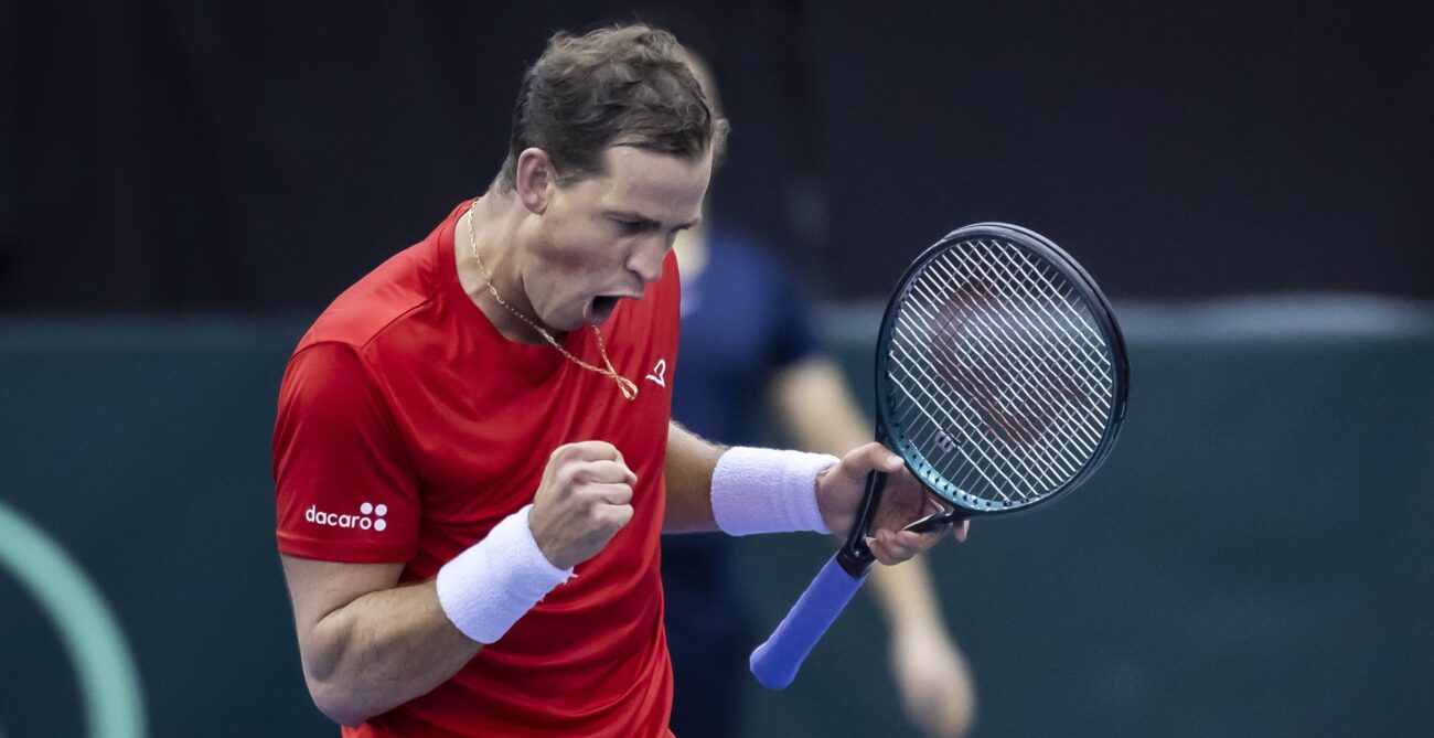 Vasek Pospisil pumps his fist and yells. He and Gabriel Diallo both won on Friday at the Davis Cup in Montreal.
