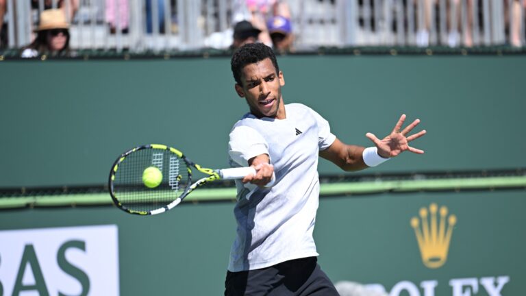 Felix Auger-Aliassime hits a forehand. He won Thursday at the Miami Open.