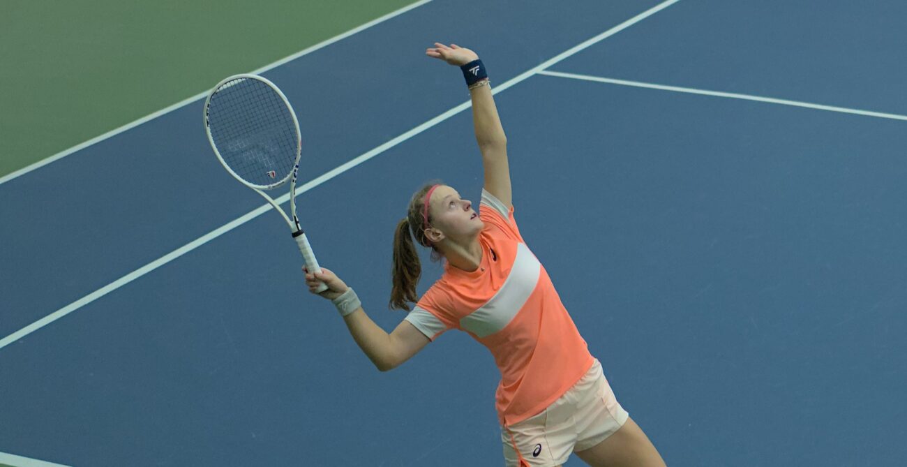 Alice Robbe tosses a ball up to serve. She and Jessie Aney are the top seeds in Montreal.