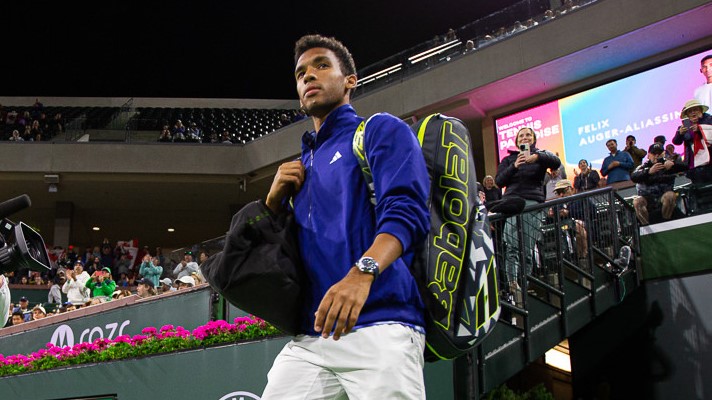 Felix Auger-Aliassime walks out onto court. He is one of five Canadians competing in Indian Wells this year.