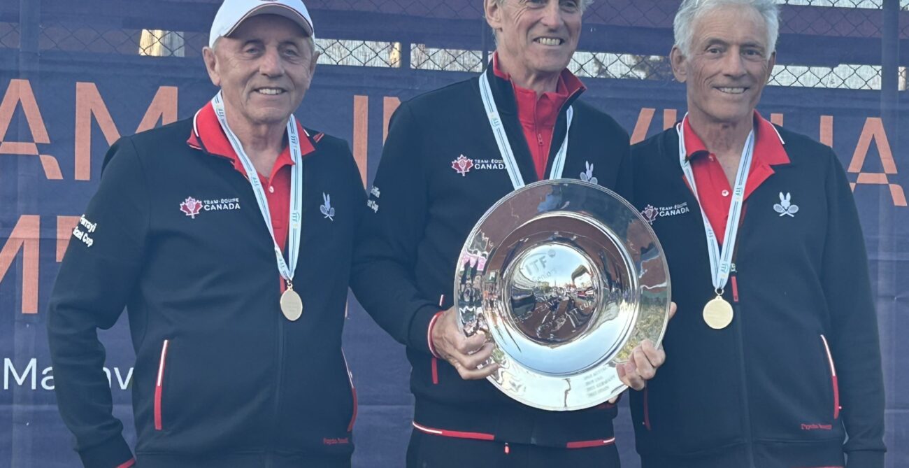 Canada's over 75 team holds up their trophy at the ITF Masters World Team Championships
