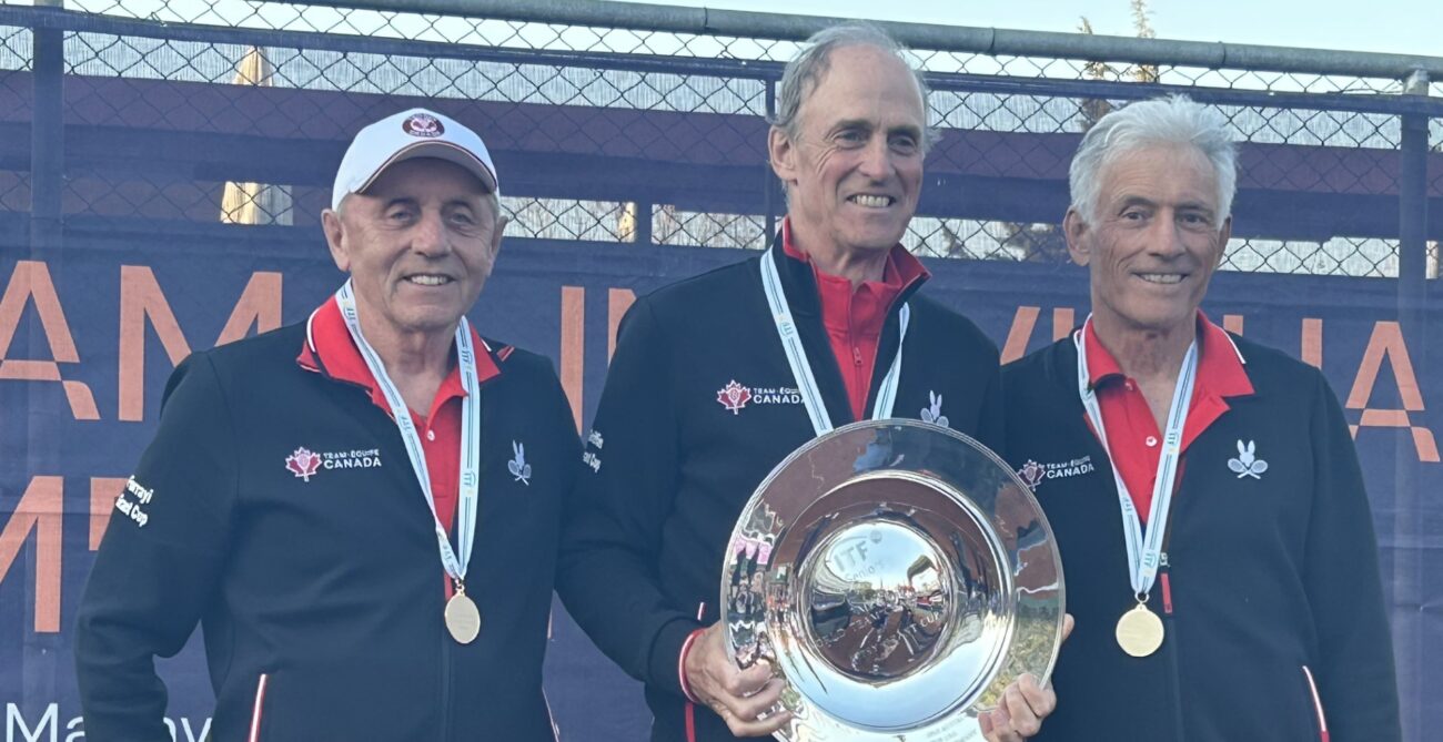 Canada's over 75 team holds up their trophy after winning gold at the ITF Masters World Team Championships