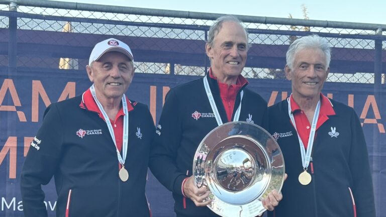 Canada's over 75 team holds up their trophy after winning gold at the ITF Masters World Team Championships