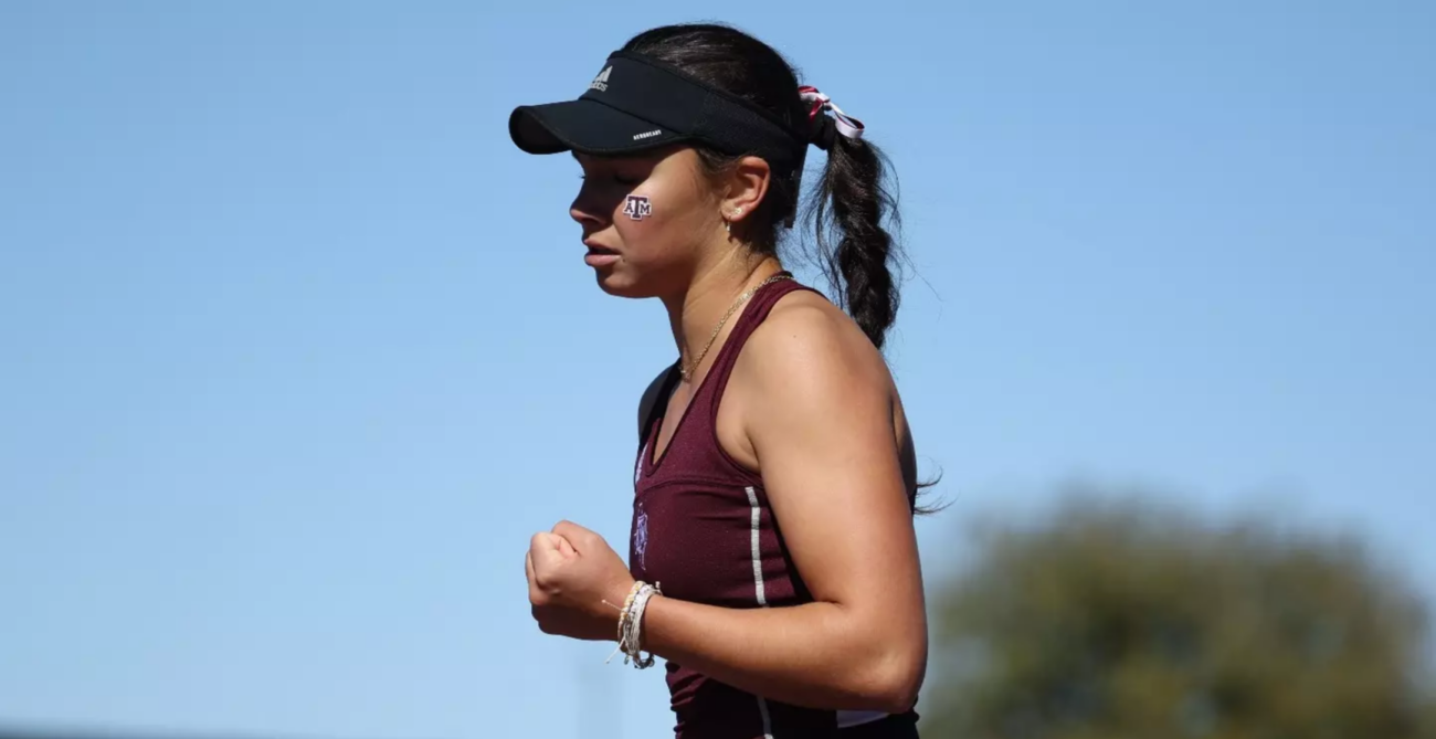 NCAA tennis player Mia Kupres pumps her fist.