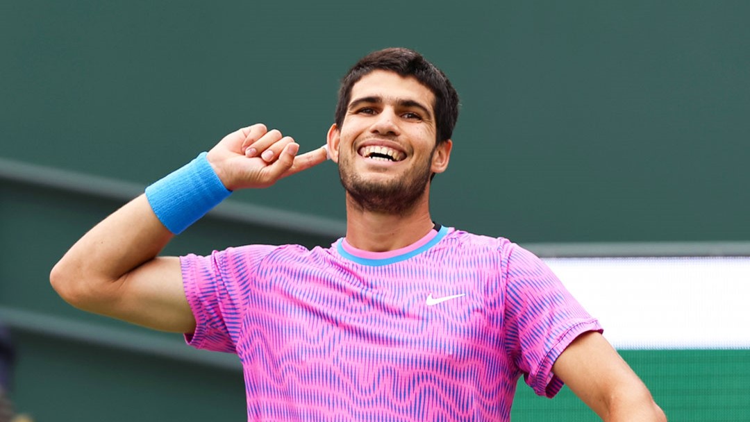 Carlos Alcaraz points to his ear to get the crowd to shout in Indian Wells. He is in the top spot on the ATP Power Rankings ahead of the clay season.