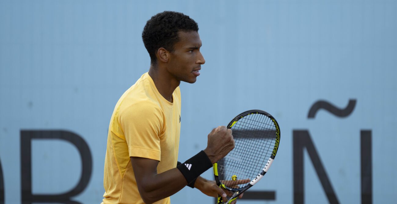 Felix Auger-Aliassime pumps his fist during a win in Madrid.
