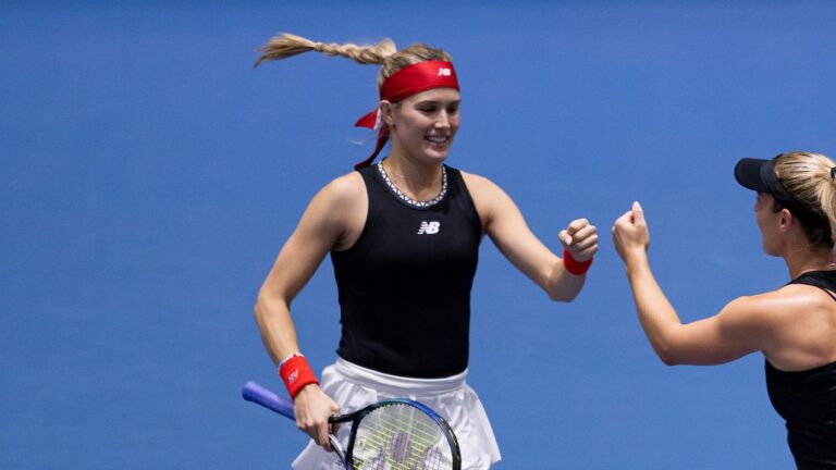 Eugenie Bouchard fist-bumps Gabriela Dabrowski. Bouchard competed at an ITF event this week.