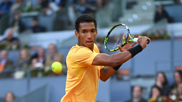 Felix Auger-Aliassime winds up to slice a backhand. He lost to Andrey Rublev in the Madrid final.