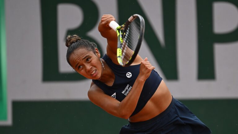 Leylah Fernandez follows through on a serve at the French Open. She lost to Ons Jabeur on Friday at Roland-Garros.