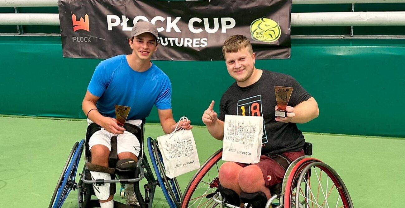 Thomas Venos (right) holds up his trophy from the ITF Wheelchair event in Plock, Poland.