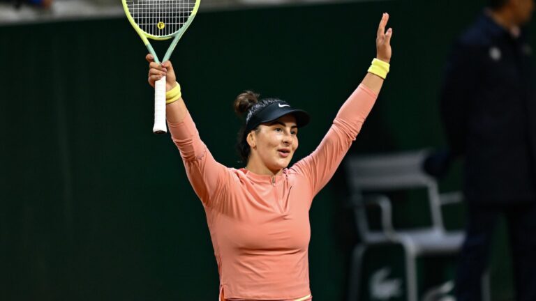Bianca Andreescu raises her arms over her head in celebration. She was one of four Canadians at Roland-Garros to have a career-best result.